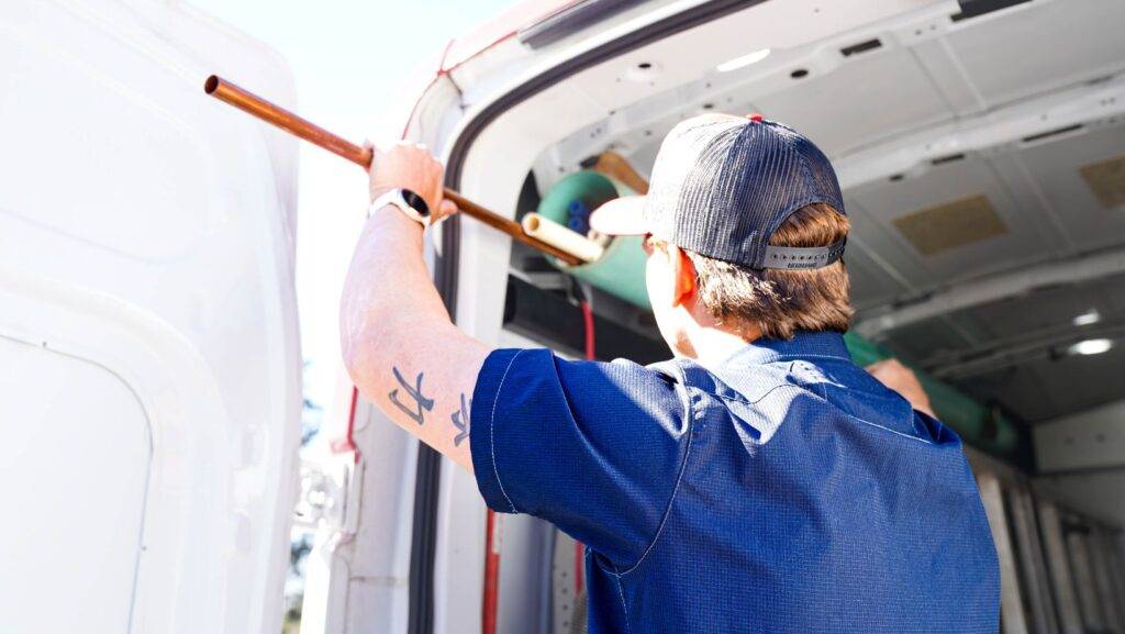 Chris's Plumbing technician preparing piping for a whole-house repiping project